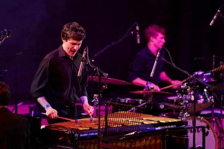 People playing vibraphone and drum kit
