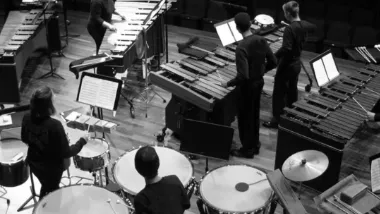 Percussion ensemble playing marimba, timpani and concert toms